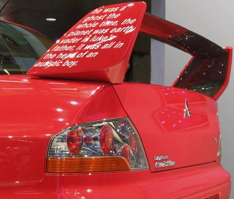 Driver covers car spoiler in movie spoilers.