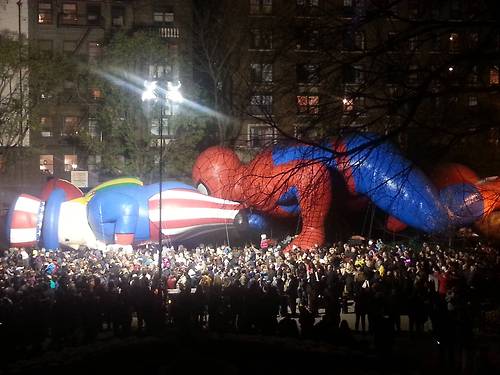 Thanksgiving parade balloons caught in unintentionally inappropriate position.