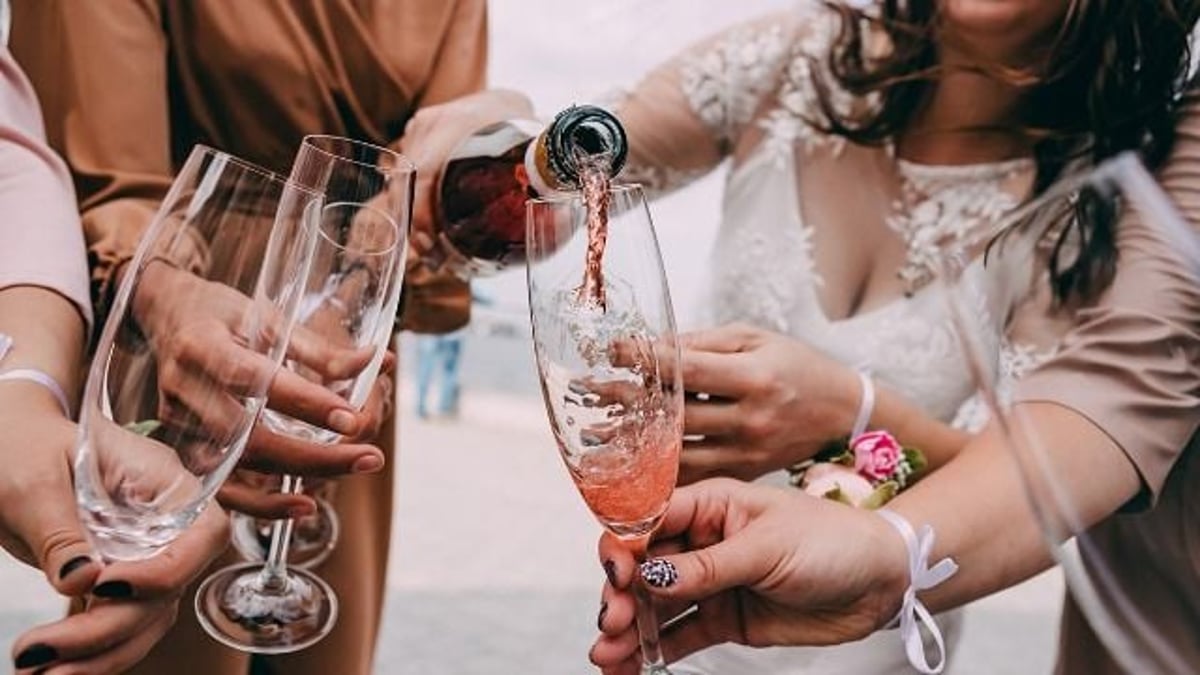'AITA for not kicking my BFF out of my wedding after she 'spilled' a drink on my SIL?'