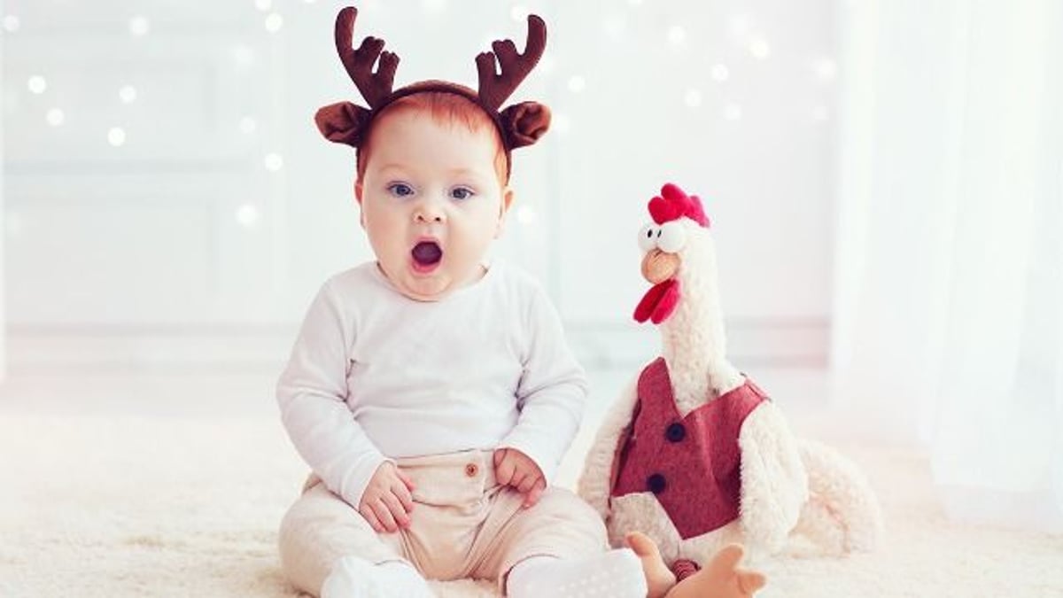 Woman doesn't want Christmas card from friend's baby; asks if it's wrong to tell her.