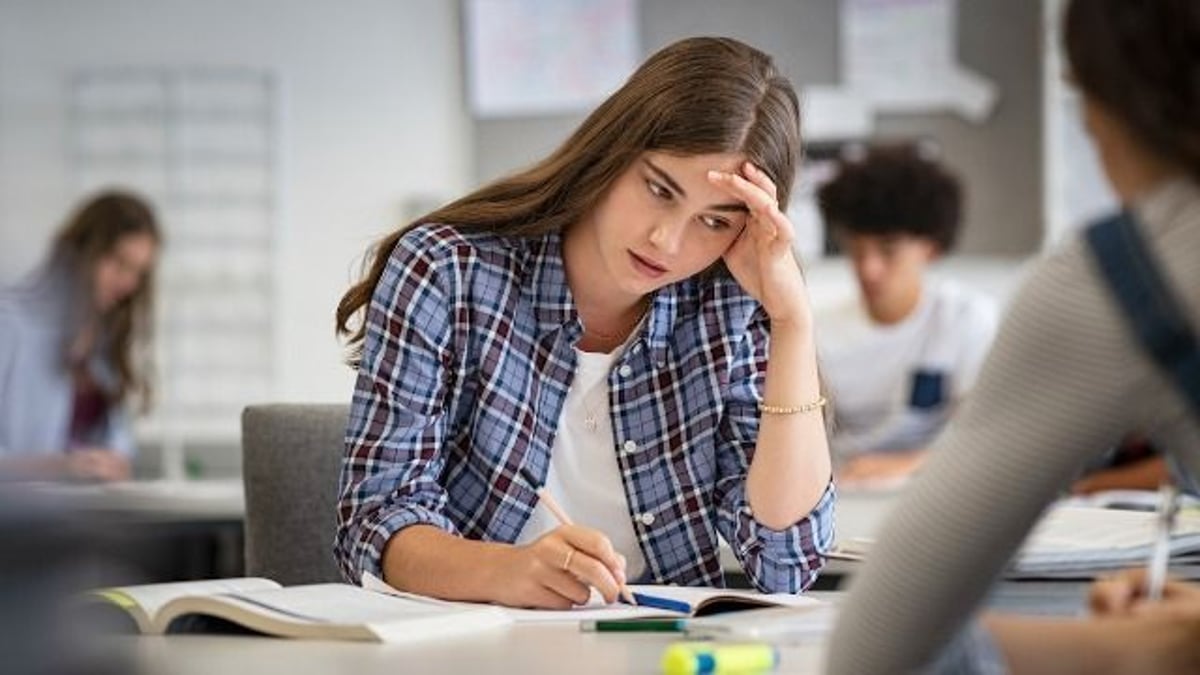 Teen shames annoyingly loud classmate by revealing her hearing aid. AITA?