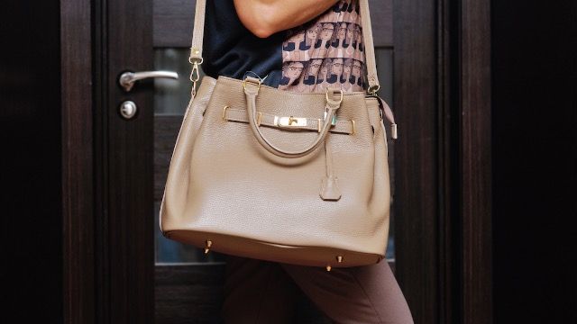 Man refuses to carry wife's heavy purse because it's 'emasculating and humiliating.'