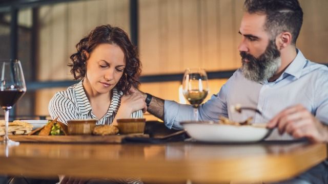 Man 'embarrasses' wife at group dinner after she calls his ex's family 'trailer trash.'