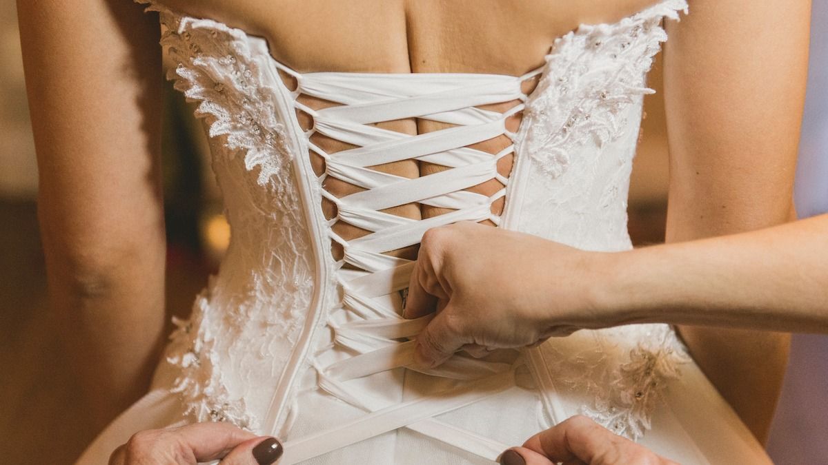 Bride makes HUGE mistake when she wears corset on wedding day. AITA? UPDATED.