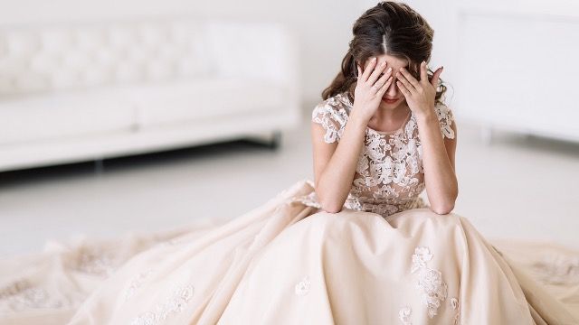 Bride rejects stepmom's wedding accessory tradition; family calls her 'selfish.'