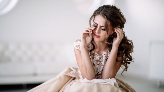 Bride upset that aunt won't attend wedding reception on date of husband's death.