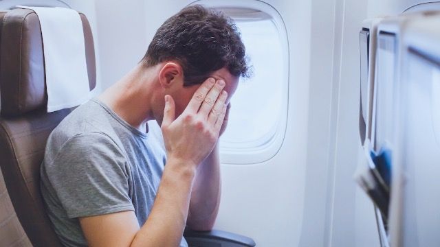 Man asks if he's wrong for asking flight attendant to make woman stop reclining seat.