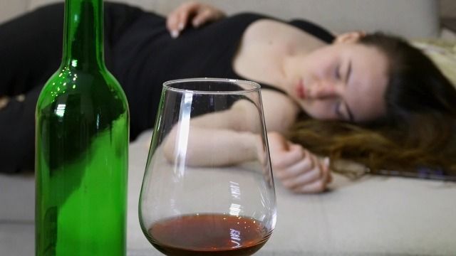 Man angry GF drinks wine, falls asleep, during his birthday movie day; he walks out.