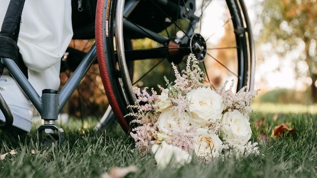 Man in wheelchair wants to join wife's girls' night in; she says no, she needs space.