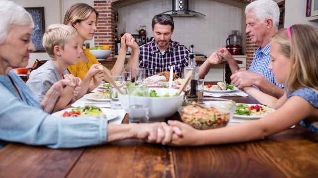 Christian woman commands man to say grace; he maliciously complies making her furious.