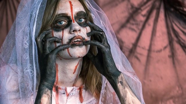 Man's ex-wife pours blood on old wedding dress for 'zombie' costume with daughter.