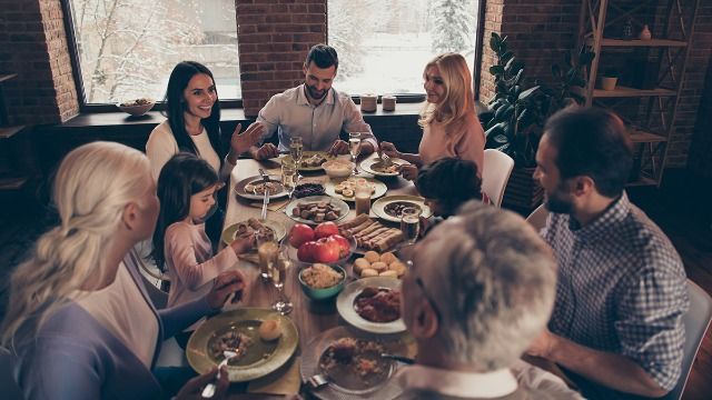 MIL accuses woman of 'ruining Thanksgiving' by sitting on husband's lap for dinner.