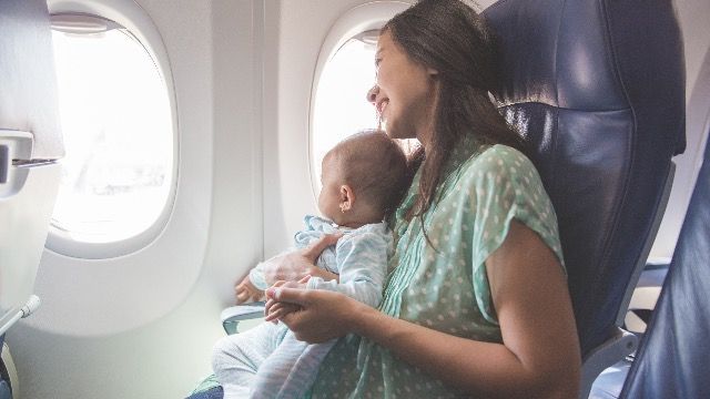 Mom asks if she's wrong to bother plane passengers with crying baby.