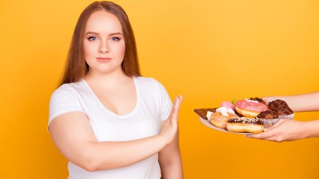 Woman on diet won't attend in-laws 'lavish' Christmas dinner, family is taking sides.