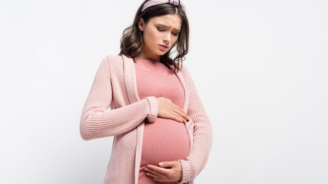 Frustrated woman tries to keep pregnancy a secret from gossiping coworkers.