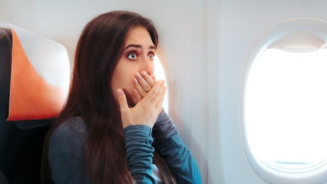 Woman asks if she's wrong to tell 27 year old cousin to 'act her age' during flight.