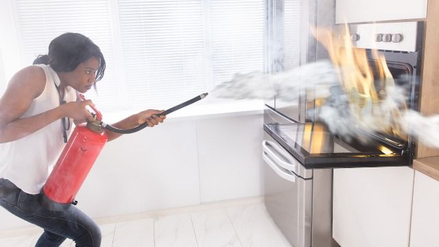 Woman child locks stove against fire prone stepsister, hellfire ensues. AITA?
