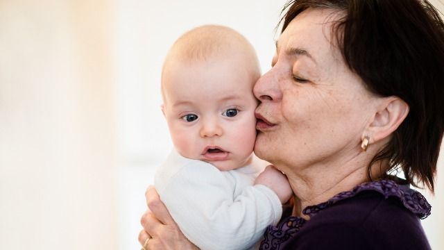 Woman doesn't want her mom kissing her baby because of her cold sores. AITA?