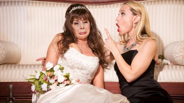Mom crashes estranged daughter's wedding in her own wedding dress. UPDATED