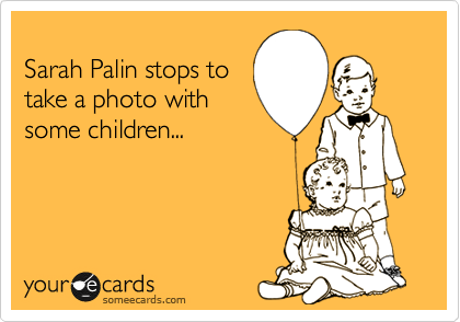 
Sarah Palin stops to 
take a photo with 
some children...