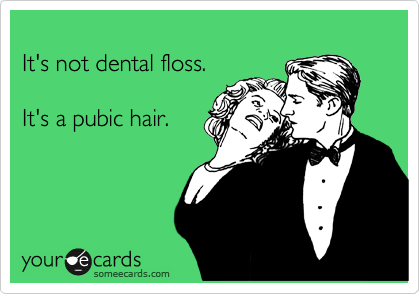 
It's not dental floss.  

It's a pubic hair.